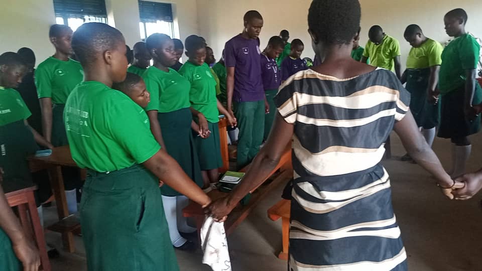 St. Paul's Vocational Secondary School club members pray after a Bible study.