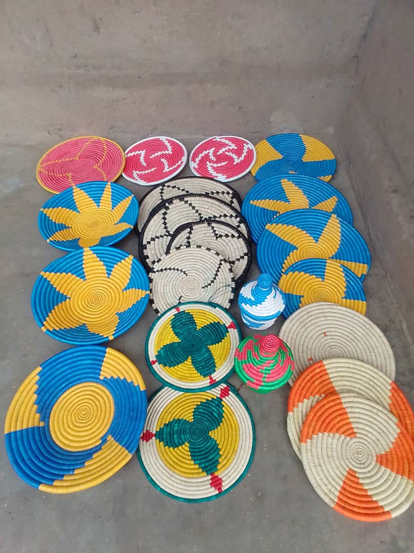 Colorful handwoven basket trays displayed together.