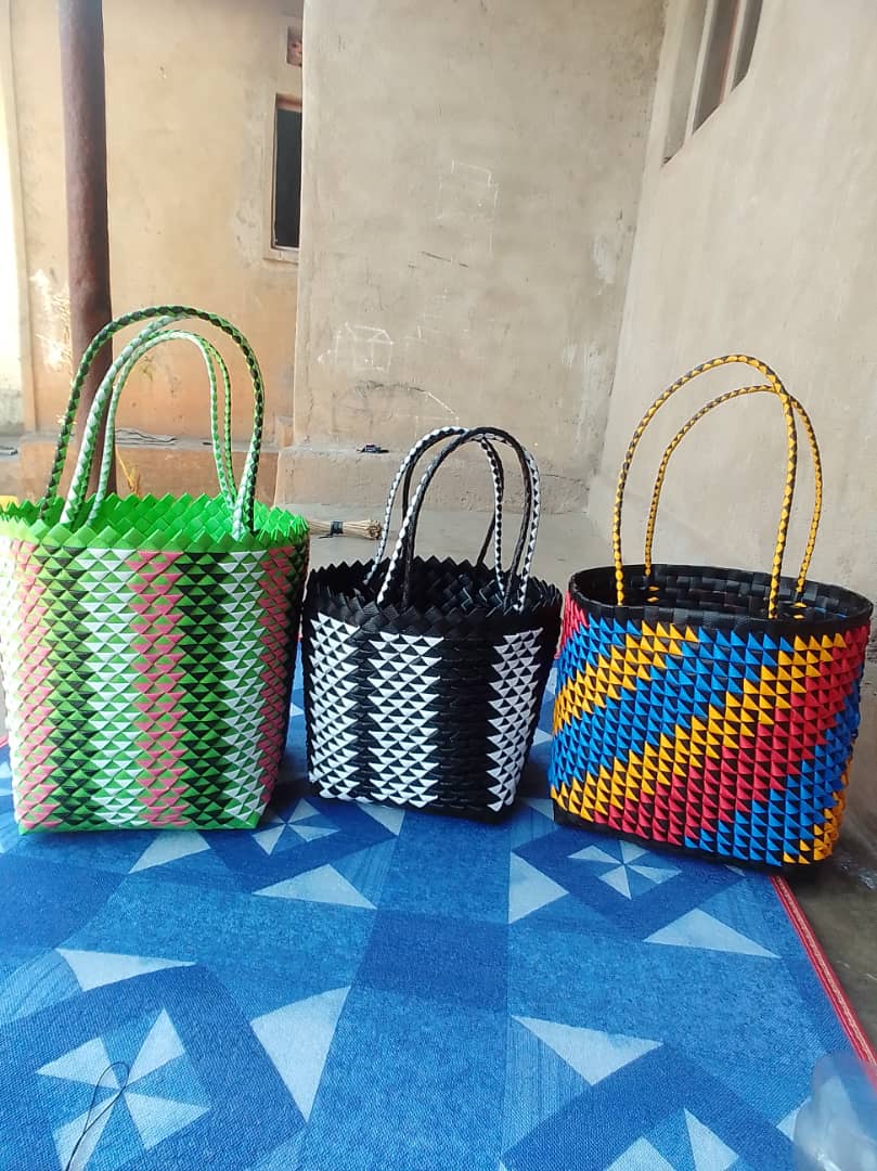 Colorful handwoven baskets displayed together.