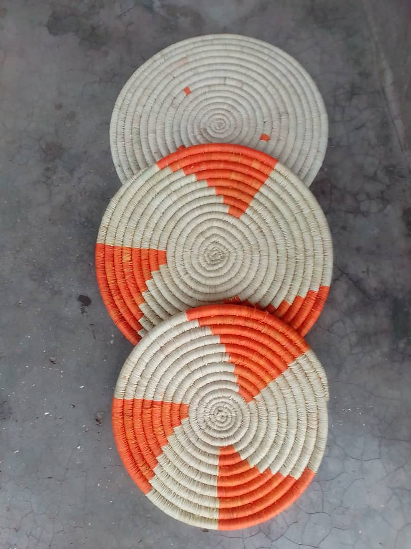 Handwoven mats displayed together.
