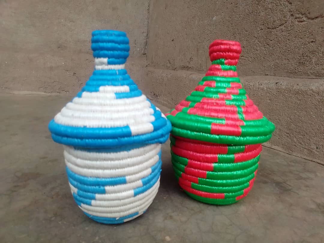 Small covered handwoven baskets.